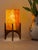 Comet pairs a hand-carved Egyptian alabaster shade with a geometric walnut base, combining contemporary form with...