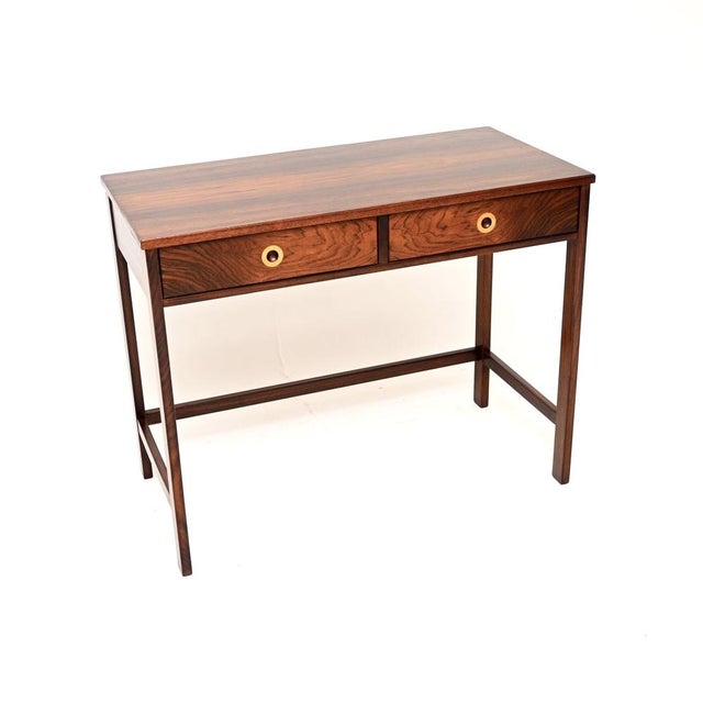 A stunning vintage console table / desk, made in England and dating from the 1960’s. It is of superb quality with an...