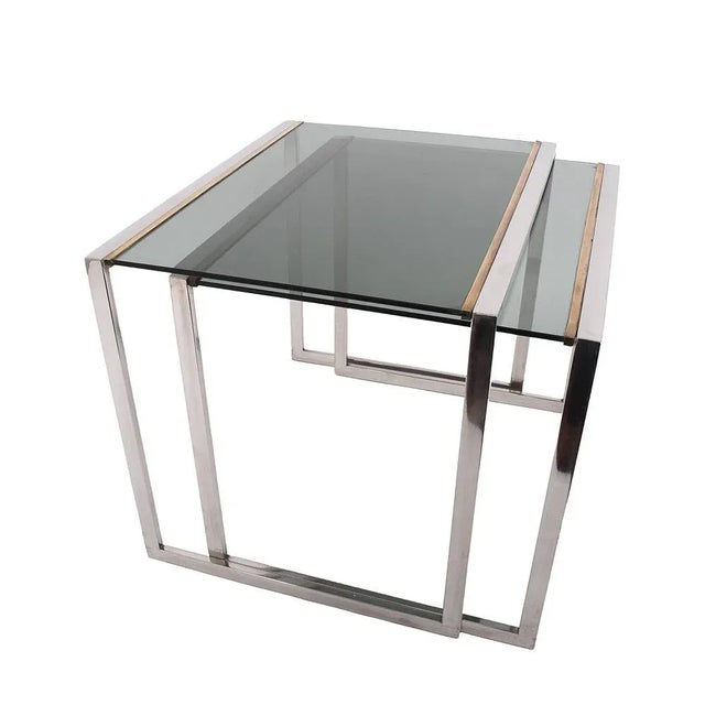 Mid-century modern Nesting tables in brass and crystal, France 1970s. A very classic pair of nesting tables from the 70s,...