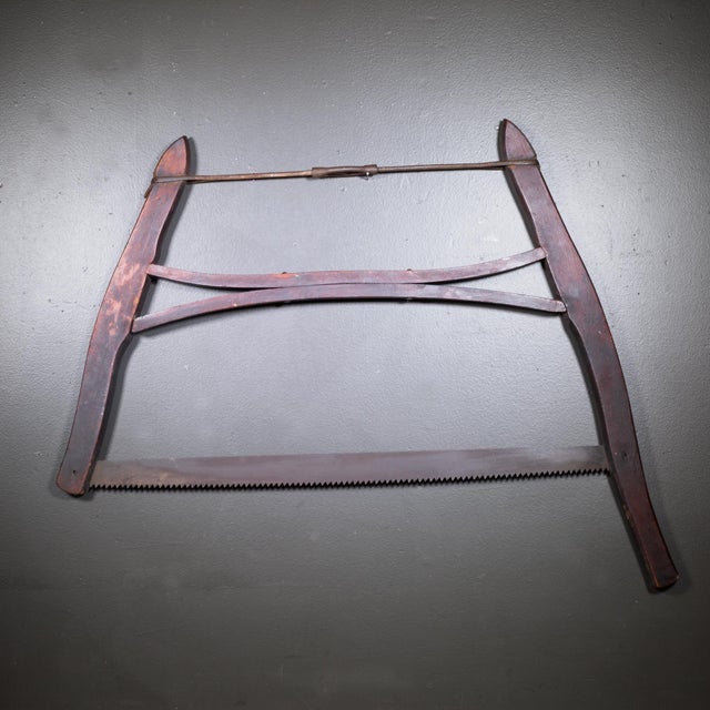 ABOUT A Mahogany buck saw with steel tension rod and blade. CREATOR Unknown. DATE OF MANUFACTURE c.1910-1930. MATERIALS...