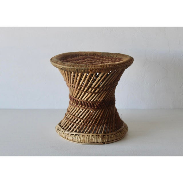 Vintage woven bamboo and rattan stool or plant stand with an hourglass drum shape, natural cane accents, and a side...