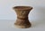 Vintage woven bamboo and rattan stool or plant stand with an hourglass drum shape, natural cane accents, and a side...