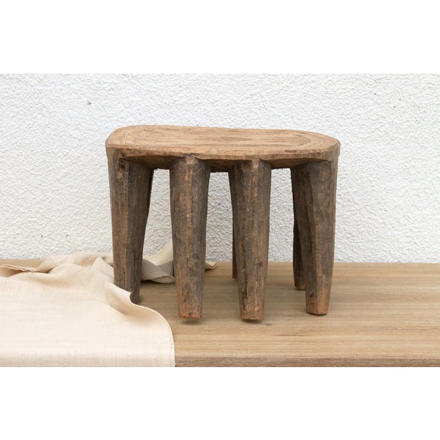 A unique piece of African art, this vintage Nupe table from Nigeria is a must-have for collectors and enthusiasts of Nupe...