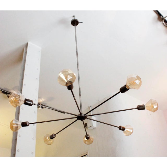 This ceiling lamp is made of aged iron with an industrial character and has eight arms. Both the height and the diameter...