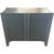 Vintage two-door cabinet with fluted door fronts and a painted charcoal finish. The clean-lined silhouette and textured...