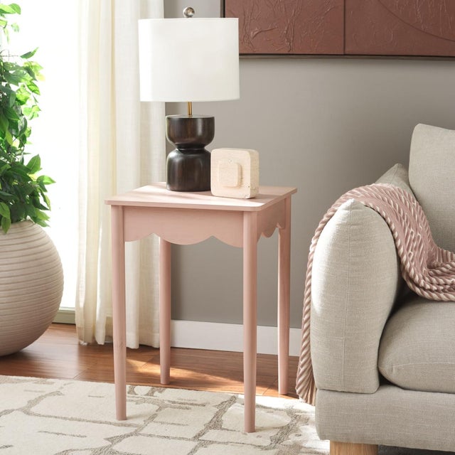 Enhance your home with the Paislynn Accent Table in a tranquil pink color. This elegant table features a versatile design...