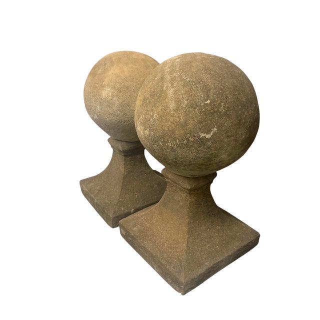Introduce a touch of timeless architectural elegance to your estate with this striking pair of vintage cast stone sphere...