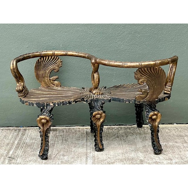 This vintage gilt carved grotto tête-à-tête presents a theatrical, sculptural silhouette, with two shallow, shell-form...