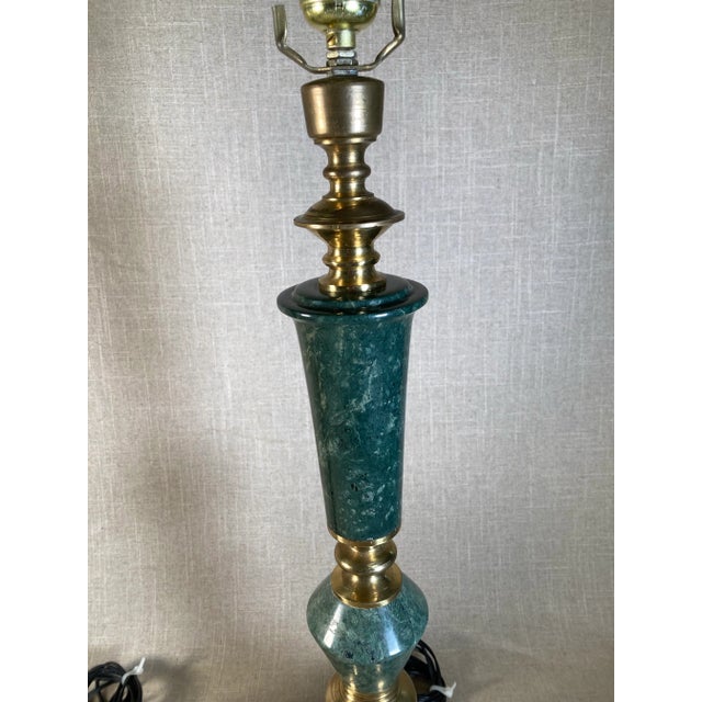 A pair of elegant solid marble and brass table lamps circa 1960s in good working condition