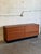 This minimalist lowboy profile offers substantial storage space across eight spacious compartments. Clean geometric lines...