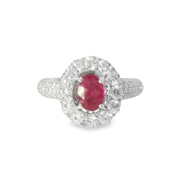 14K White Gold Ruby Micro Pave Diamond Designer Ring. This elegant designer ring features one natural oval ruby weighing...