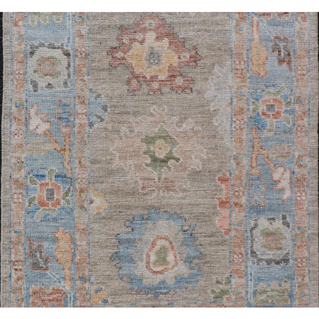 Measures: 2'7 x 4'0 Modern Floral Oushak With Sandy-Brown Background and A Sky Blue Border. Keivan Woven Arts; rug...