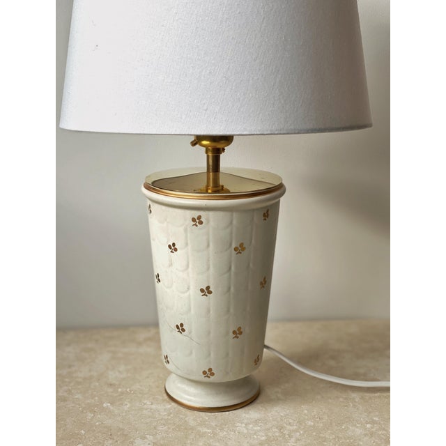 Wilhelm Kåge Stoneware Table Lamp "Carrara" in beautiful creme color. Textured, Matte, Creme Colored Lamp Base featuring a...