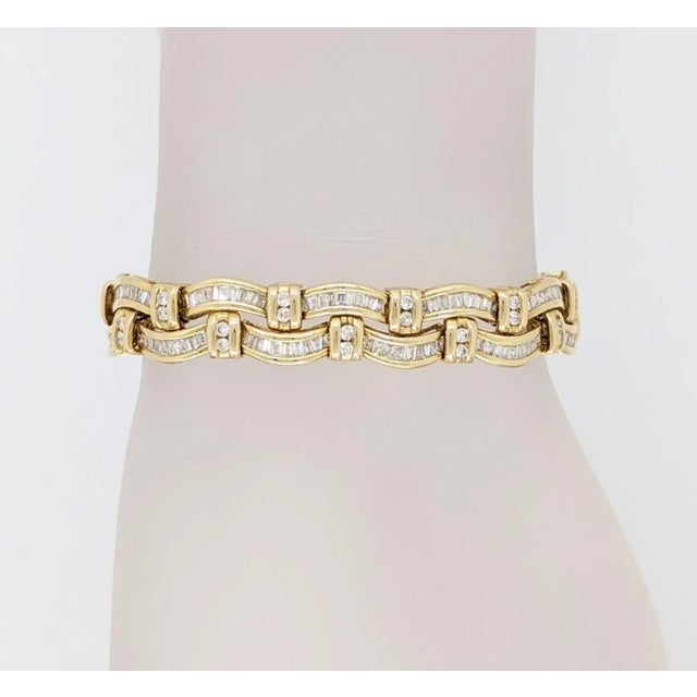 Beautiful bracelet with 6.00 ct. of good quality white diamond baguettes and rounds. Handmade in 14k yellow gold. Length...
