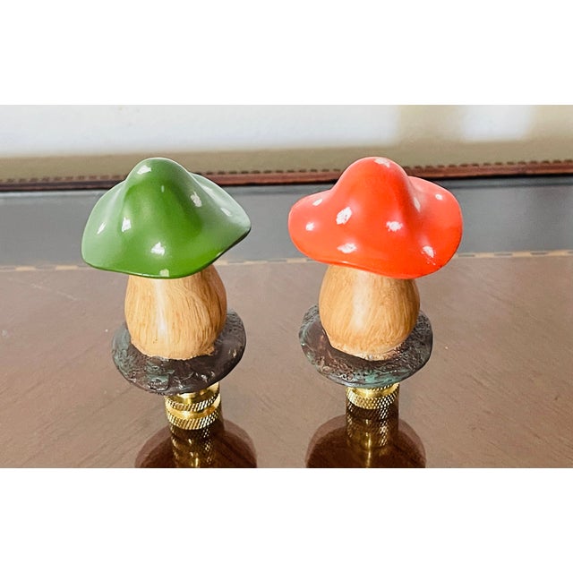 Cute pair of small mushroom figurines on brass bases as lamp finials.