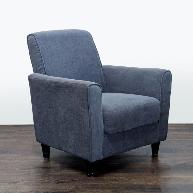 This DH lounge chair features a clean, modern design with soft blue fabric upholstery. The padded seat and back provide...