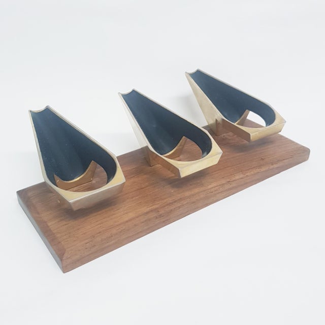 Mid century 3 pipe desk stand mounted on a bevelled wood block. The angular design of the metal holders give it a sleek,...
