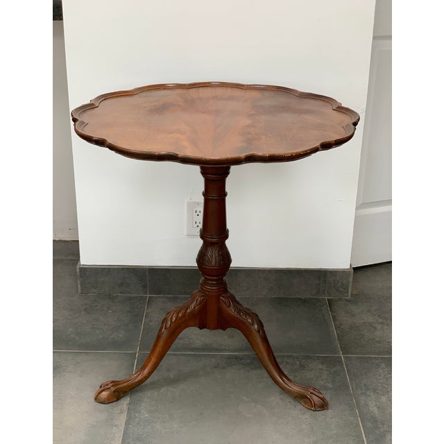 Mahogany ball and clawfoot tilt top piecrust table made by Fine Arts Furniture Co. in Grand Rapids. This since 1927...