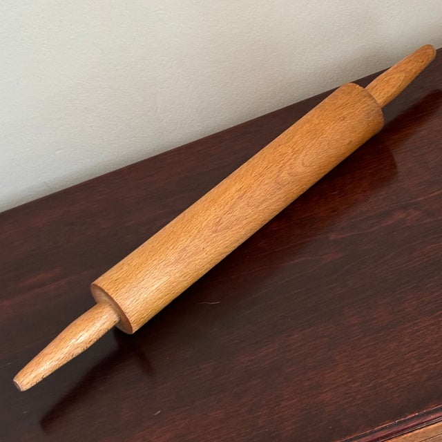 An adorable mid-20th century wood rolling pin. Love the warm wood finish and narrow, 1950s-style handles. Lots of vintage...