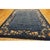 1920s Antique Wool Allover Floral Rectangle Blue Hand Knotted Pile Rug, Circa Date: 1920s. This exquisite example of early...