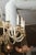 This is truly a grand example of a mid-century Venetian glass chandelier. It showcases sixteen brilliant sweeping glass...