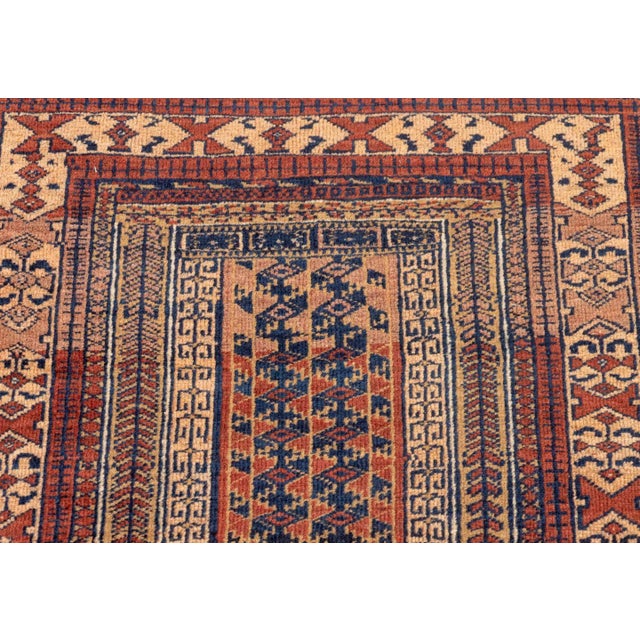 Afghan Balouch Wool Prayer Rug, with geometric design to the center on tan and red ground. 5' 6" L x 3' 2" W. Provenance:...
