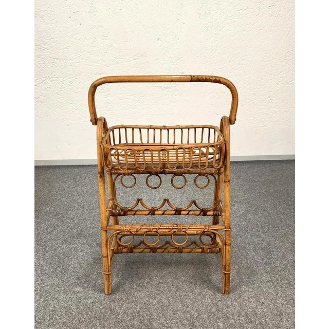 A very elegant and beautiful service table with bottle holder. This item is made of bamboo and rattan and has two floors,...