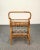 A very elegant and beautiful service table with bottle holder. This item is made of bamboo and rattan and has two floors,...
