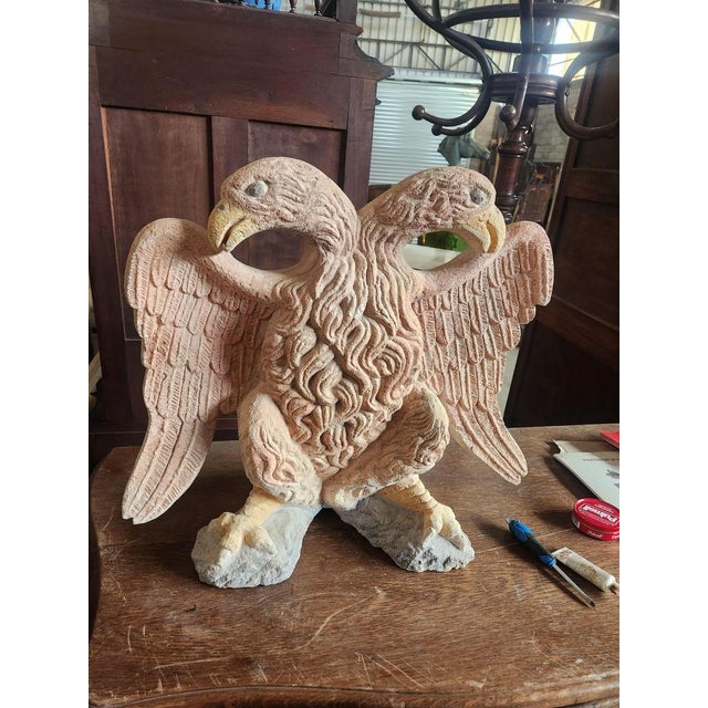 16th limestone two -headed eagle with original polychrome The colors are faded