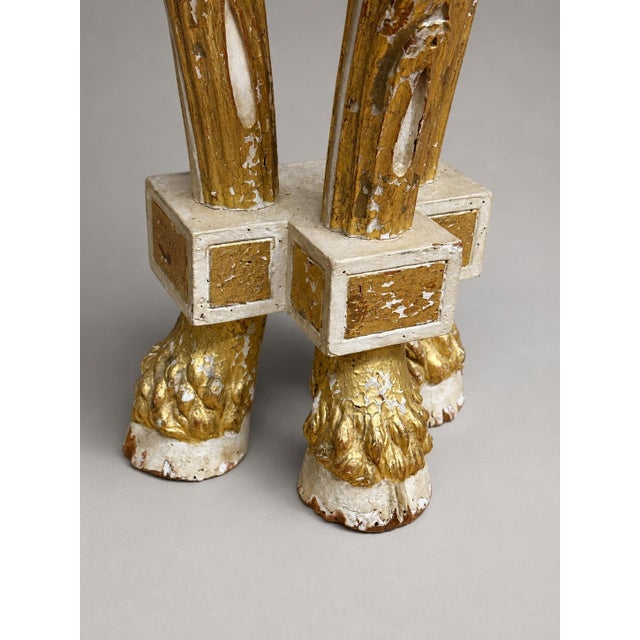 An exceptional 18th-century Italian parcel-gilt and cream-painted demilune console table, probably Northern Italian or...