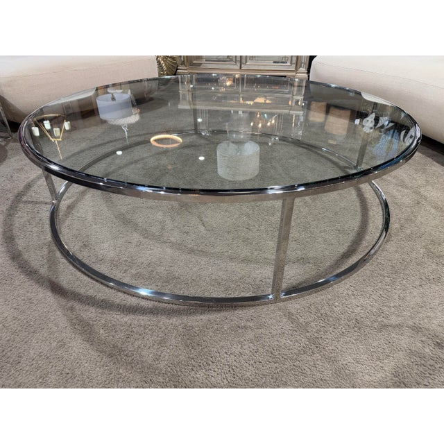 A refined statement in modern design, this Restoration Hardware Round Glass Top Coffee Table showcases the brand’s...