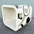 A bold Postmodern waterfall side table crafted in tessellated stone and adorned with an eye-catching abstract inlay...