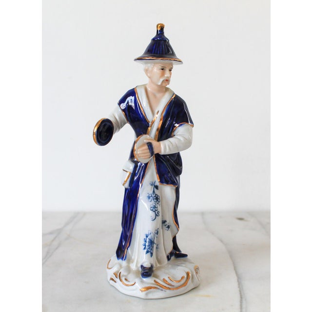 Vintage Asian porcelain musician figurine in traditional dress. Marked "KPM" on the bottom. No chips or cracks. Light age...