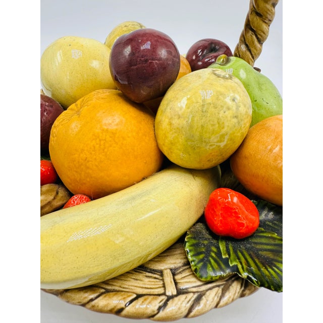This pretty ceramic basket is filled with fruit! Such a lovely decorative piece, the neutral colors are a nice mix with a...