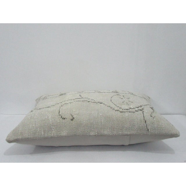 Decorative pillow cover made from a vintage Turkish handknotted rug. Backed with good quality cotton fabric. Pillow...