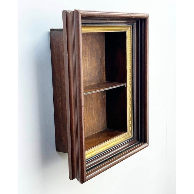 Awesome antique framed shadow box wall shelf. A great way to display small trinkets or hang in a bathroom as a little John...