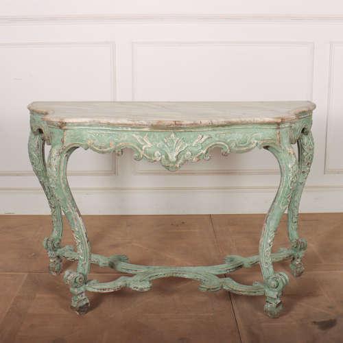 Pretty 19th century Italian painted serpentine carved console table with a faux marble top. 1890. This piece is designed...