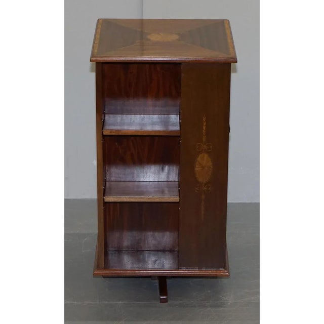 Stunning circa 1900 burr walnut and mahogany revolving bookcase with Sheraton inlay to the top An exceptionally well made...