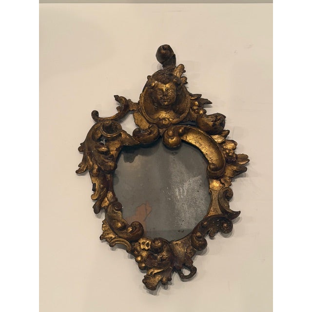 Characterful Venetian Baroque style carved gilded wood mirror having original mercury glass. Wonderful patina. RR