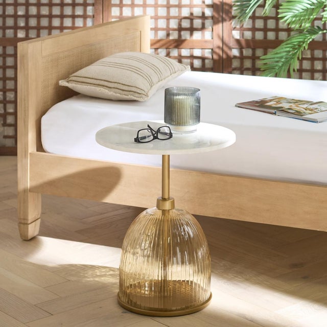 Discover a fresh touch of sophistication for your living space with the Kashi Side Table. This stylish piece blends the...