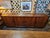 Stunning vintage 1960s Mid Century Modern rosewood credenza featuring gorgeous dramatic wood grain, clean architectural...