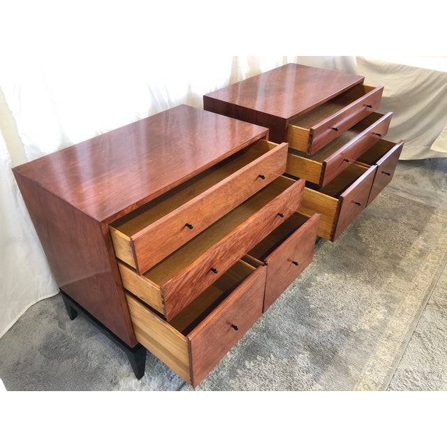 Professionally refinished pair of floating chests in brown/red with black lacquered bases and original black pulls.