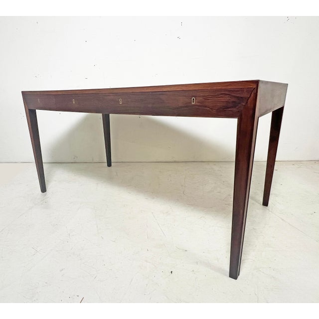 A rosewood desk, Model 36, designed by Hans Severin Hansen for Haslev Mobelsnedkeri, circa late 1950s. Hansen's furniture...
