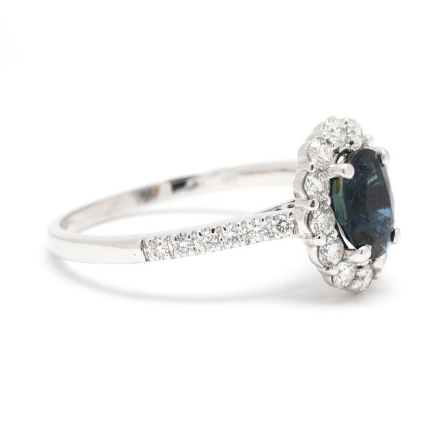 Stones: sapphire, 1 oval cut 7 x 5 mm approximately 1.1 total carats diamond round brilliant cut 1.2 - 2 mm approximately...