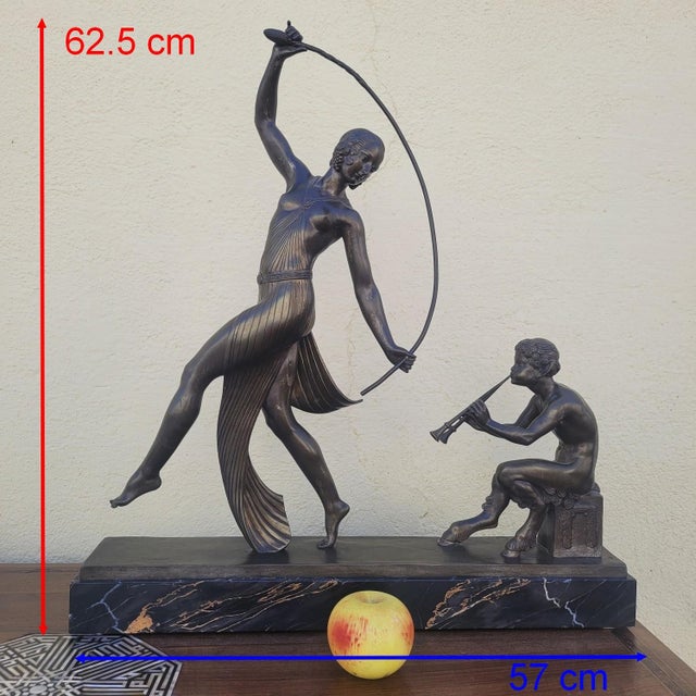 Beautiful Art Deco patinated bronze sculpture of a dancer with a thyrsus before a flute-playing faun, on a Portoro marble...