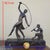 Beautiful Art Deco patinated bronze sculpture of a dancer with a thyrsus before a flute-playing faun, on a Portoro marble...