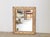 A French giltwood mirror from the early 20th century, with faux-bois carved frame and clear mirror plate. Created in...