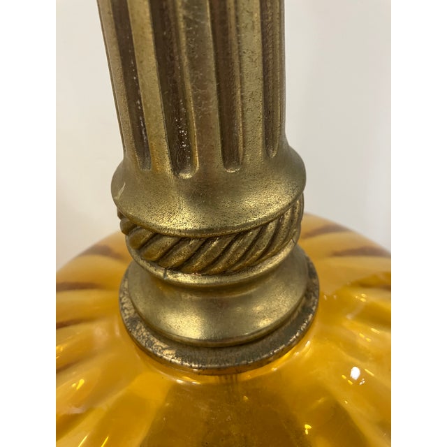 This pair of 80’s lamps feature amber glass The diameter of the glass is 11 inches Nice over scale size at 23 inches...