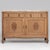 An Art Nouveau oak buffet featuring soft curvature and a marble top. The piece incorporates flowing lines and decorative...