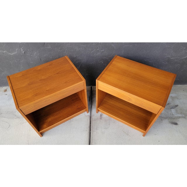 A pair of teak Danish Modern nightstands. Each with a single drawer and shelf storage. In exceptional original condition....